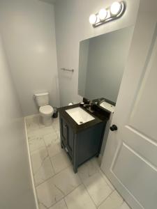 a bathroom with a sink and a toilet at The Nook, Private Beach House by Vynmir in Fort Bragg +13 photos
