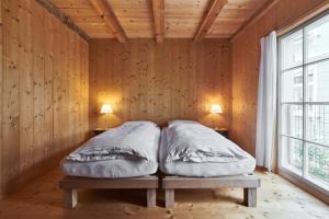 Ein Bett oder Betten in einem Zimmer der Unterkunft Fischerhäuser Romanshorn