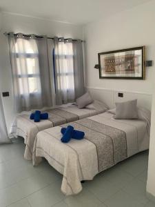 Posteľ alebo postele v izbe v ubytovaní Dúplex Maspalomas