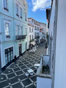 a view from a window of a street with buildings at Open Door Loft in Ponta Delgada