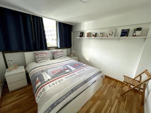a bedroom with a bed with a fire truck bed at Type 3 entièrement rénové vue pleine mer Malo in Malo-les-Bains