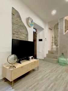 TV a/nebo společenská místnost v ubytování LG LAKE - Boutique apartments and rooms -