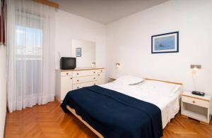 Postel nebo postele na pokoji v ubytování Apartment Definis