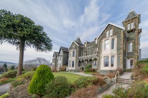 a large house with a tree in front of it at Highfield in Keswick