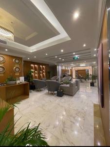 a lobby with couches and chairs in a building at رام جده للشقق الفندقيه Ram Jeddah in Jeddah