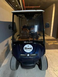 a golf cart is parked in a garage at Root Redrock Yalıkavak in Bodrum City