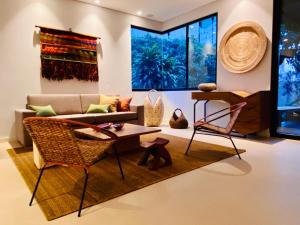 a living room with a couch and chairs at Patio del Mundo in Medellín