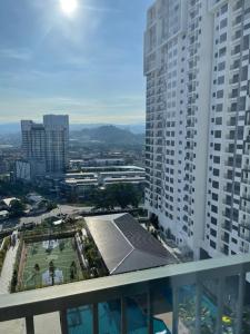 a view from the balcony of a building with a tennis court at Sheera Islamic Homestay 2r2bathroom Free Wifi with tv channels Netflix Coway Water in Cheras