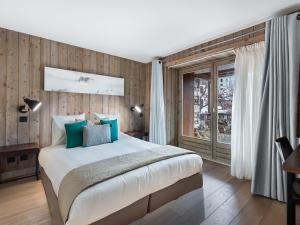 Ein Bett oder Betten in einem Zimmer der Unterkunft Appartement Val-d'Isère, 4 pièces, 9 personnes - FR-1-567-33