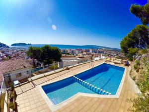 a large swimming pool on top of a house at Trill Las Brisas 2-4 pers in L'Estartit +16 photos