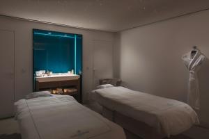 Le Barthélemy Hotel & Spa客房内的一张或多张床位