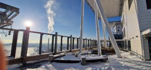 a balcony of a building with snow on the ground at Sea & City view Home near Nature in Helsinki