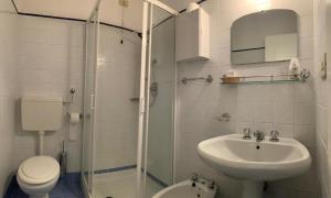 a bathroom with a sink and a toilet and a shower at Albergo Dell'Angelo in Pieve di Teco