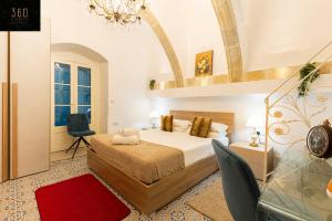 a bedroom with a bed and a red rug at 1BR Charming townhouse in capital city with WIFI by 360 Estates in Valletta
