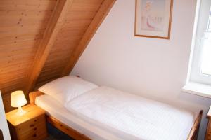 Postel nebo postele na pokoji v ubytování TP 5 - Störtebeker Komfort