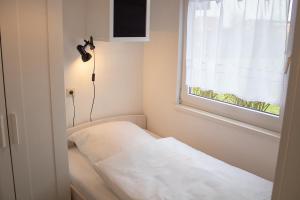 Postel nebo postele na pokoji v ubytování TP 5 - Störtebeker Komfort