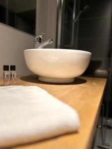 a bathroom counter with a sink and a bowl at Superbe appartement - Coeur du Vieux-Lille in Lille +7 photos
