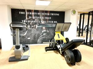 a gym with a treadmill and a exercise bike at Anmaria Beach Hotel & Spa in Ayia Napa