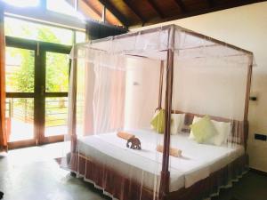 Letto o letti in una camera di Mango Tree House