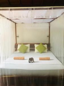 Letto o letti in una camera di Mango Tree House