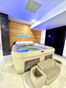 a large jacuzzi tub in a room at Anmaria Beach Hotel & Spa in Ayia Napa