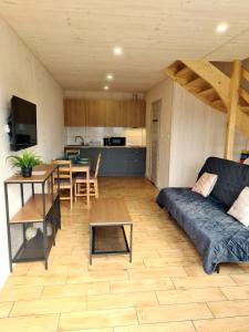 a living room with a couch and a table at Władysławowska 36 - domki i pokoje gościnne in Władysławowo