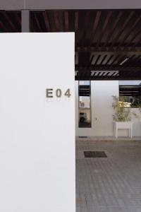 a white wall with the inscription on it at Villa Number 4 in Sharjah