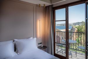 A bed or beds in a room at Ethos Suites