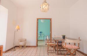 a dining room with a table and chairs at Cozy Pool House in Carvoeiro