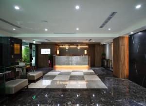 a lobby with a reception desk in a building at Hotel Cloud in Taipei