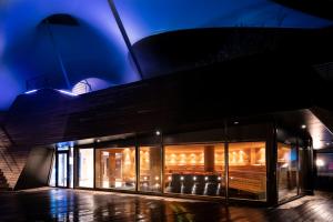 a store front of a building at night at Mokni's Palais Hotel & SPA in Bad Wildbad