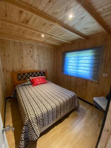 Llit o llits en una habitació de Les Chalets du Belvédère