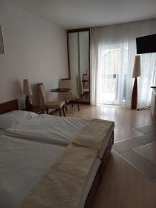 Łóżko lub łóżka w pokoju w obiekcie Pensjon Paradise