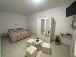 Postel nebo postele na pokoji v ubytování Apartman Nina