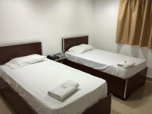 Postel nebo postele na pokoji v ubytování Residencial Turístico El Descanso