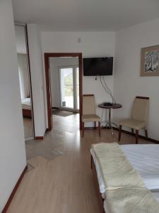 Telewizja i/lub zestaw kina domowego w obiekcie Pensjon Paradise