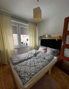 Posteľ alebo postele v izbe v ubytovaní Apartament Sanna