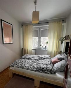 Posteľ alebo postele v izbe v ubytovaní Apartament Sanna