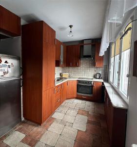 Kuchyň nebo kuchyňský kout v ubytování Apartament Sanna