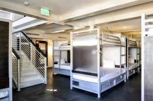 two bunk beds in a room with a staircase at Posh South Beach in Miami Beach