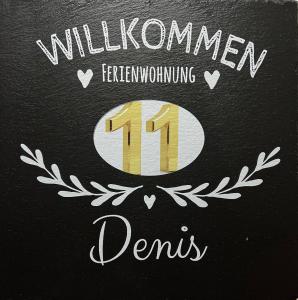 een teken met het nummer met een laurierkrans bij 3 Zimmer Ferienwohnung Denis in Oberwesel