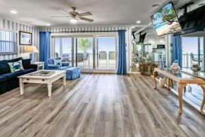 a living room with a couch and a table at Sunset Villas 3 in Clearwater Beach