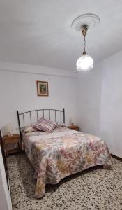 En eller flere senge i et værelse på Casa Rural Ramos