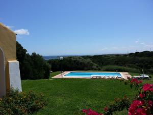 a view of a swimming pool from a house at Villa Serena B in Stintino