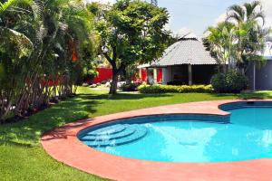 Bazén v ubytování Casa Palmera con Aire acondicionado Alberca Wifi cocina y TV nebo v jeho okolí