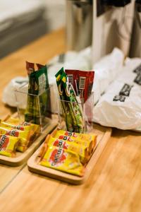 two bags of chips sitting on a table at Royce Boutique Betong in Betong