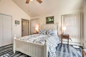 a bedroom with a large bed with a white bedspread at Westerly Vacation Home: Town Beach Access in Westerly