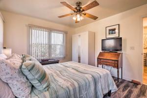 a bedroom with a bed and a flat screen tv at Westerly Vacation Home: Town Beach Access in Westerly