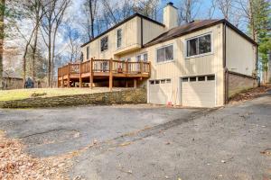 a large house with a porch and a driveway at Louisville Area Home Deck, Fire Pit, Creek! in Prospect