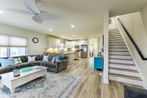 a living room with a couch and a table at Sunny Brigantine Townhome Walk to Beach in Brigantine